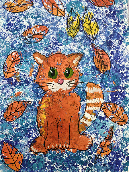 Котенок в осенних листьях